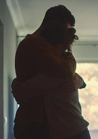 A couple embracing in silhouette, stock photography