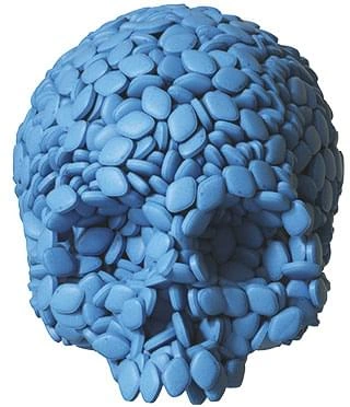 A human skull constructed from blue tablets, stock imagery from a supplier's material